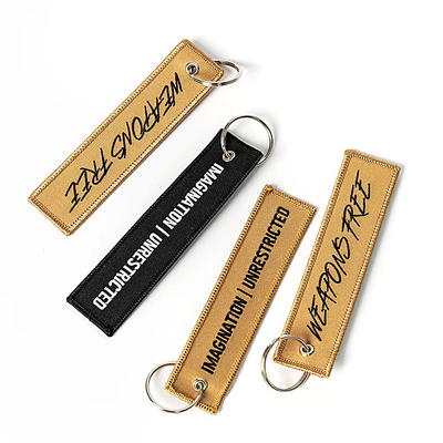 Grosir Olecranon Hook Murah Custom Flight Kain bordir Jet tag Woven Keychain Dengan Logo Anda Sendiri