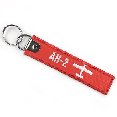Grosir Olecranon Hook Murah Custom Flight Kain bordir Jet tag Woven Keychain Dengan Logo Anda Sendiri