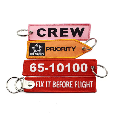 Grosir Olecranon Hook Murah Custom Flight Kain bordir Jet tag Woven Keychain Dengan Logo Anda Sendiri