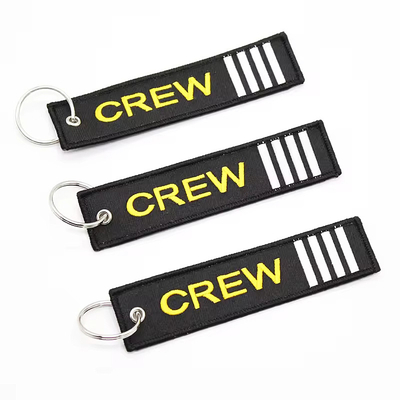 Grosir Olecranon Hook Murah Custom Flight Kain bordir Jet tag Woven Keychain Dengan Logo Anda Sendiri