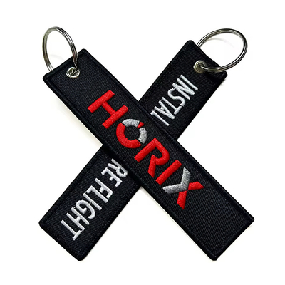 Grosir Olecranon Hook Murah Custom Flight Kain bordir Jet tag Woven Keychain Dengan Logo Anda Sendiri